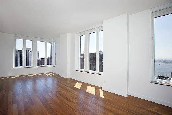 Apartment 42A at 15 William Street offers some of the most impressive views in Lower Manhattan, thanks to its high floor corner positioning and expansive oversized windows that frame the ...