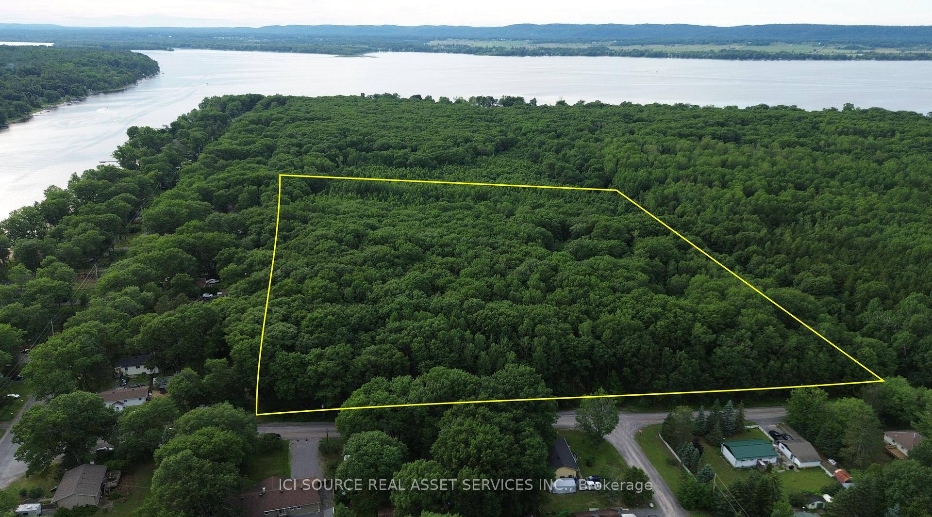 15. 7 acres of well drain mature forest lot, zoned for residential building and an accessory building.