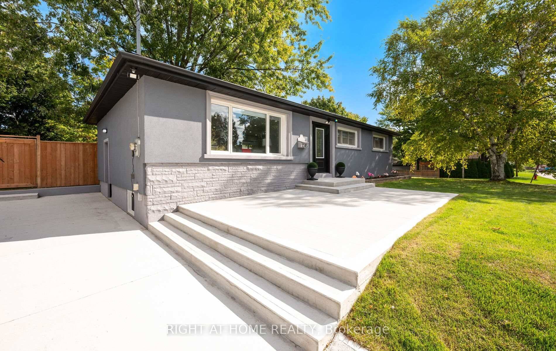 Step inside to an inviting open concept layout featuring rich hardwood floors and a cozy electric fireplace.