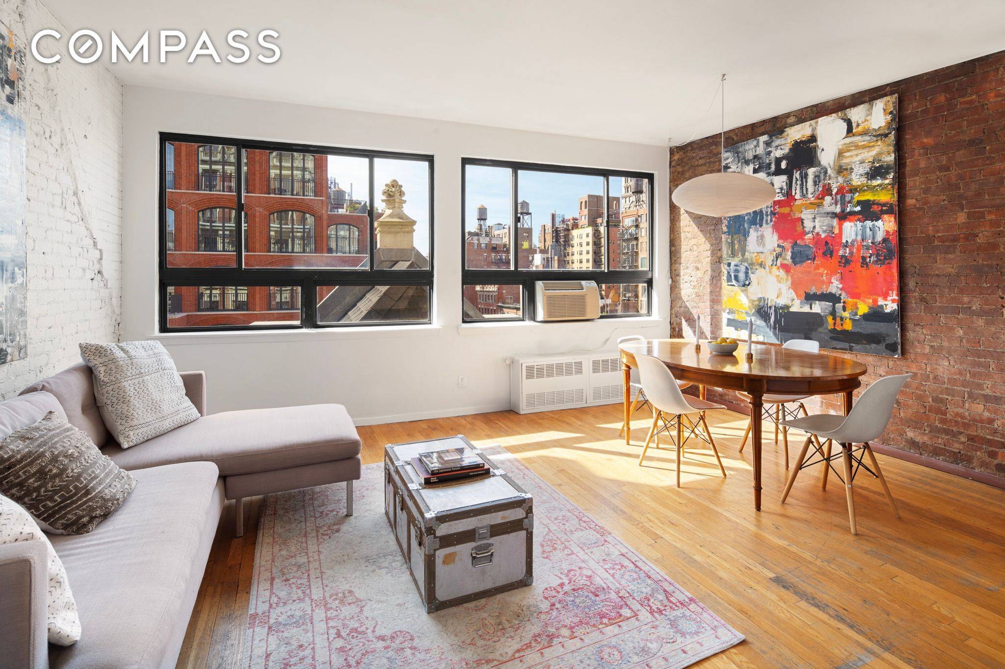This top floor 2 Bedroom loft like home in a pre war doorman building features a wall of windows and stunning western views over Greenwich Village.