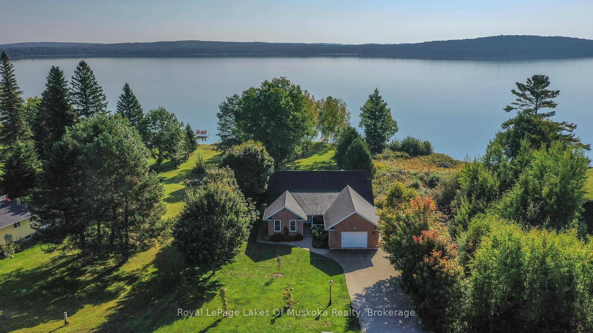 Fabulous recreational residence on private level lakefront on beautiful, clean Lake Bernard.