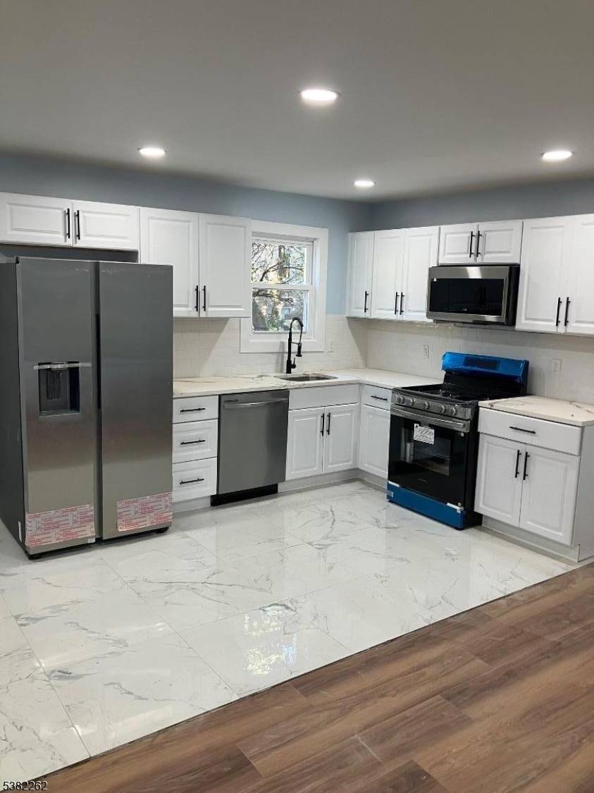 Renovated Single Family Home with 4 Bedrooms and 3 Full Baths.