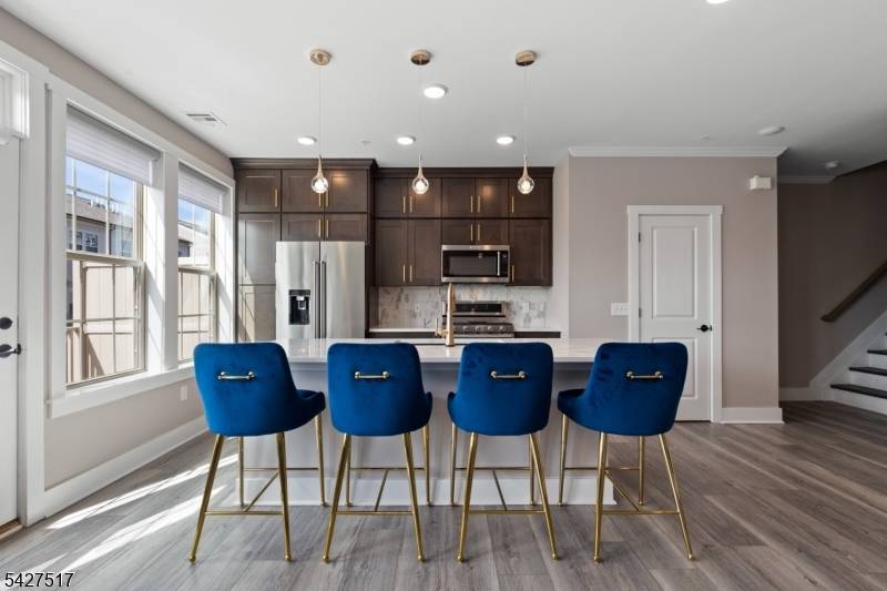 A beautifully upgraded 2 bedroom plus loft, 2 full and 1 half bath home located in the highly desirable LINK at Westmont.