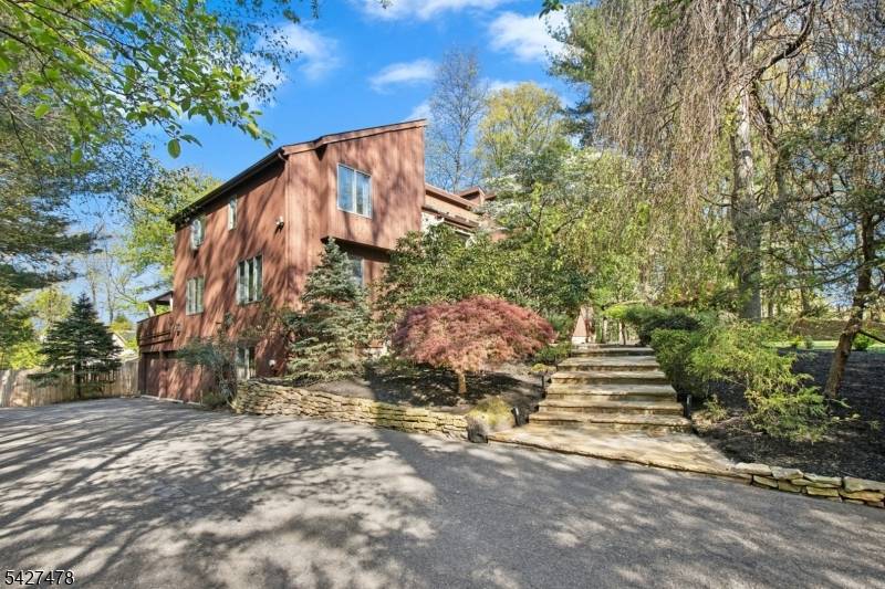 Welcome to this one of a kind 5 BR residence offering nearly 5, 000 sq ft of beautifully designed living space, set on a full acre on one of Scotch ...