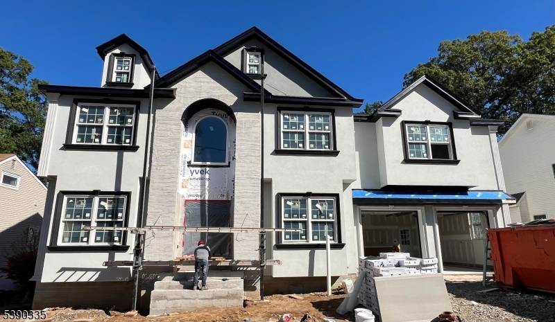 The new construction with quality material by COSMO Builders features a spacious colonial with 5 beds, 4.