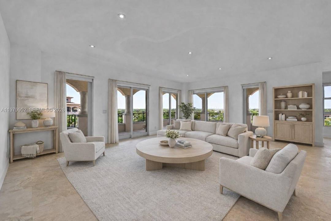 Rare, fully renovated designer penthouse in the prestigious Deering Bay community, featuring golf course amp ; bay views.