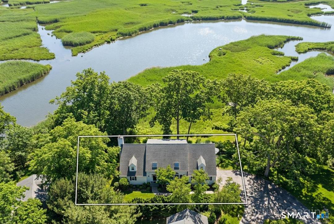 An exceptional stand alone condominium that captures the essence of luxurious coastal living.