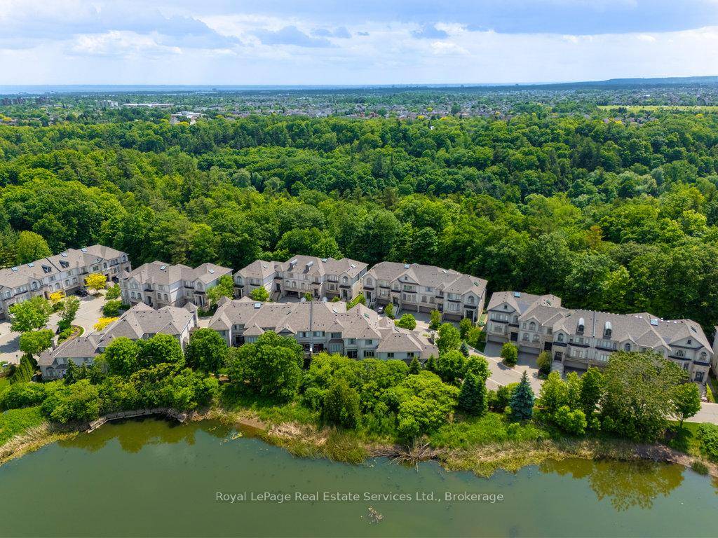 Sophisticated, tastefully updated, executive townhome backing onto greenspace and a pond with no rear neighbours in an upscale community.