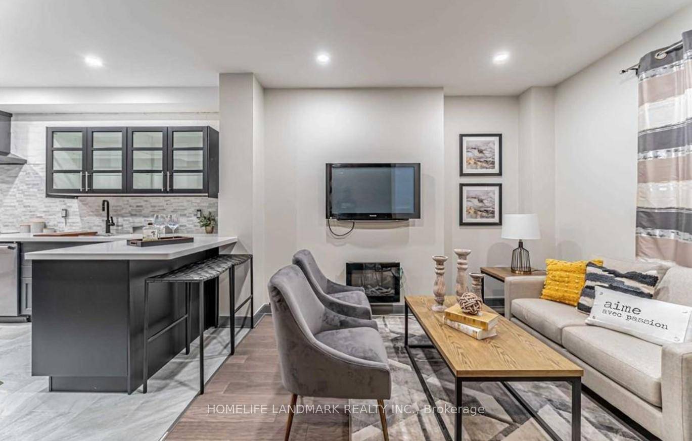 Welcome to this elegant FULLY FURNISHED 4 bedroom, 4 bathroom townhouse near Church St.