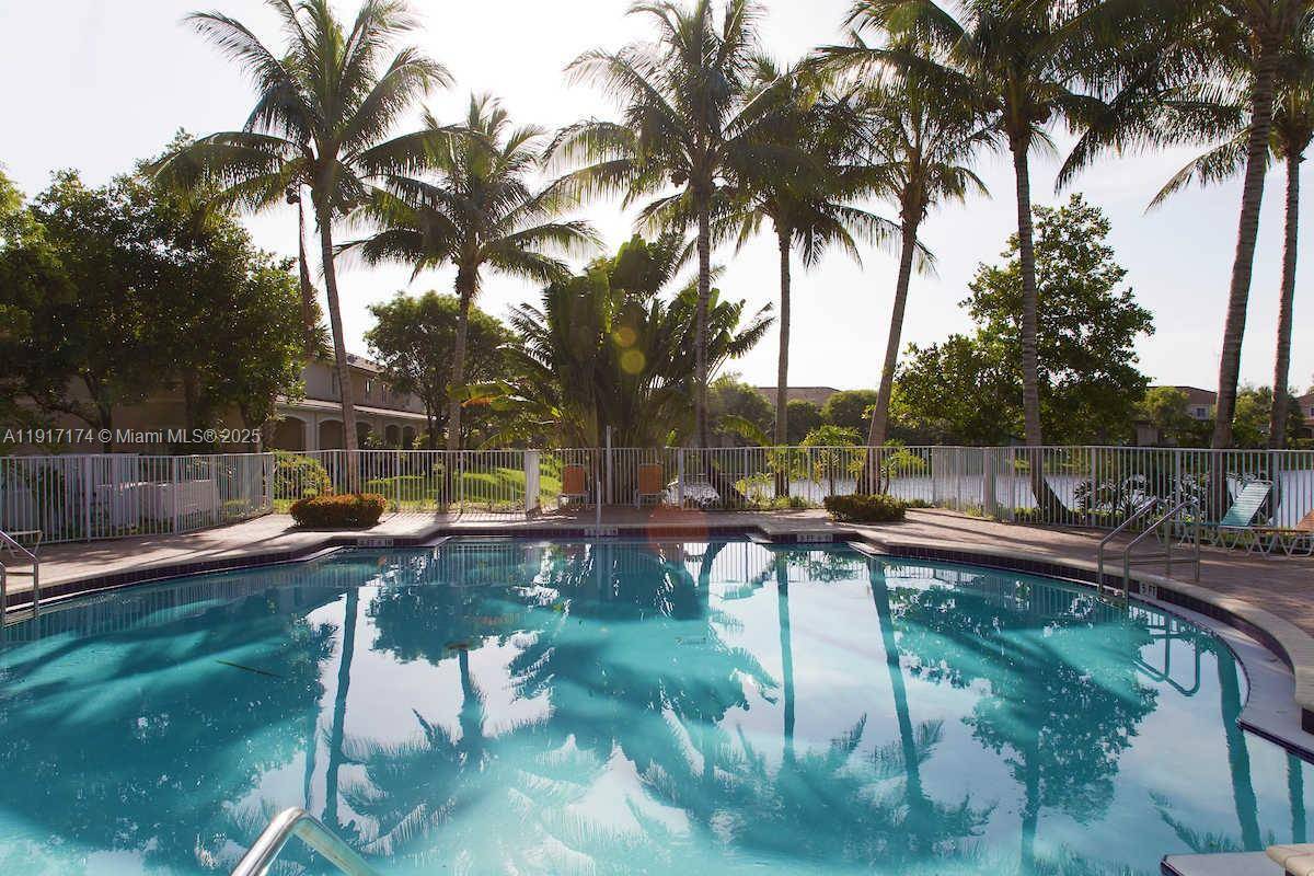 Welcome to this well maintained 2 bedroom, 2 bathroom townhome located in the desirable gated community of Tuscany in Miramar.