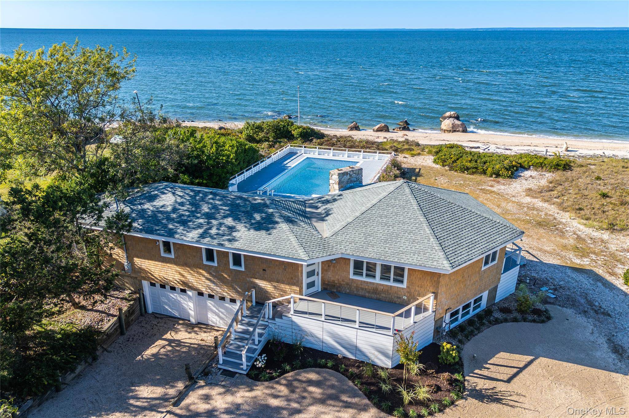 Beautiful and Spacious Soundfront Home with waterside gunite Pool.