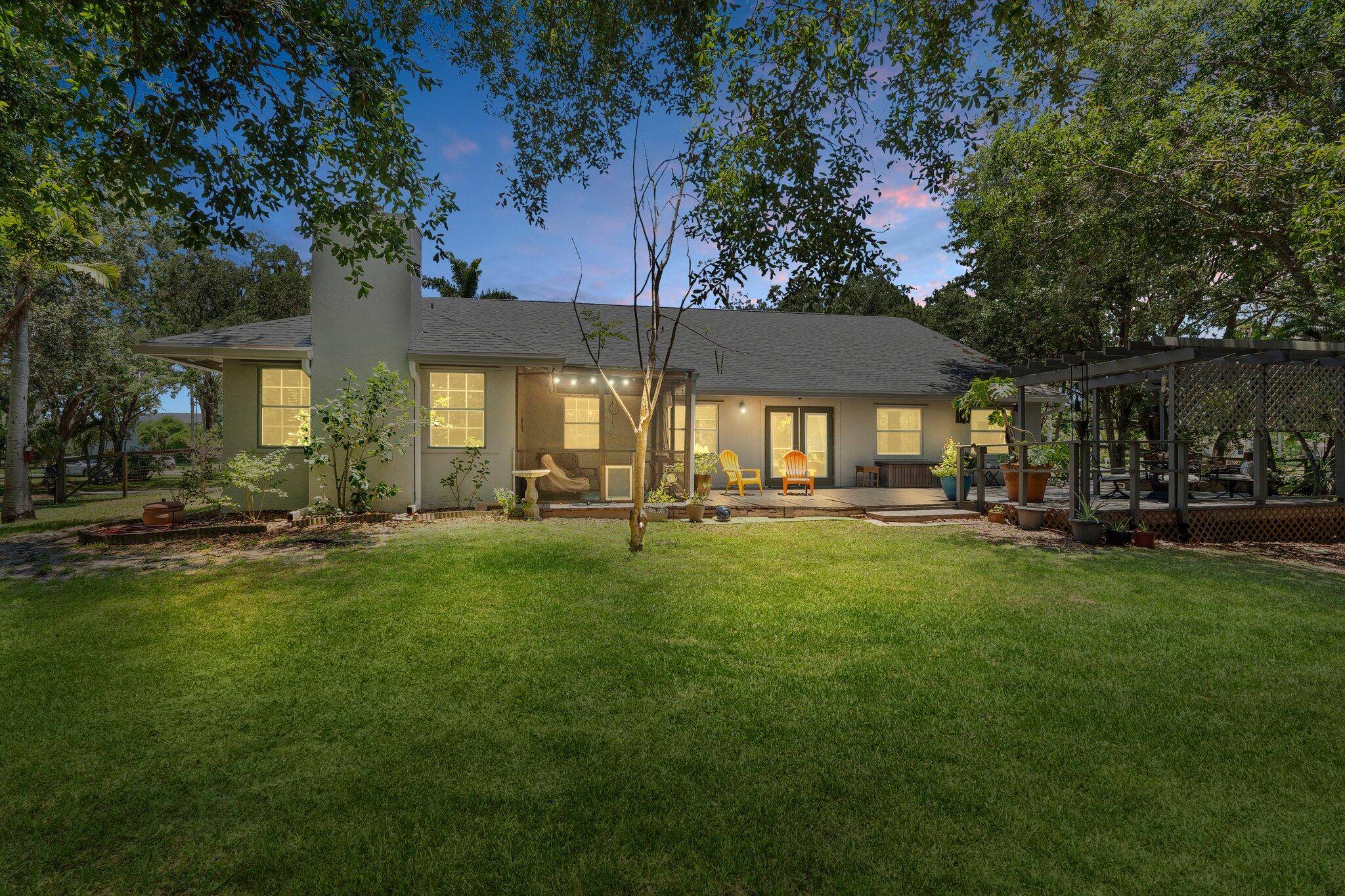 Welcome to Palm Beach Country Estates, a sought after community with HOA amenities but no required dues, acreage county only taxes.
