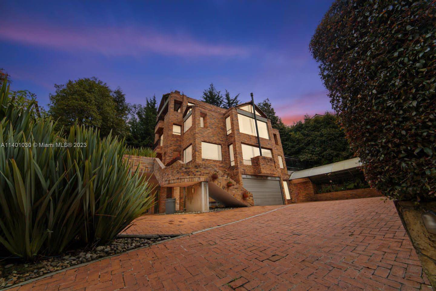 Experience luxurious living in this 3 story fully furnished mansion in Colina de Suba, Bogotá, Colombia.