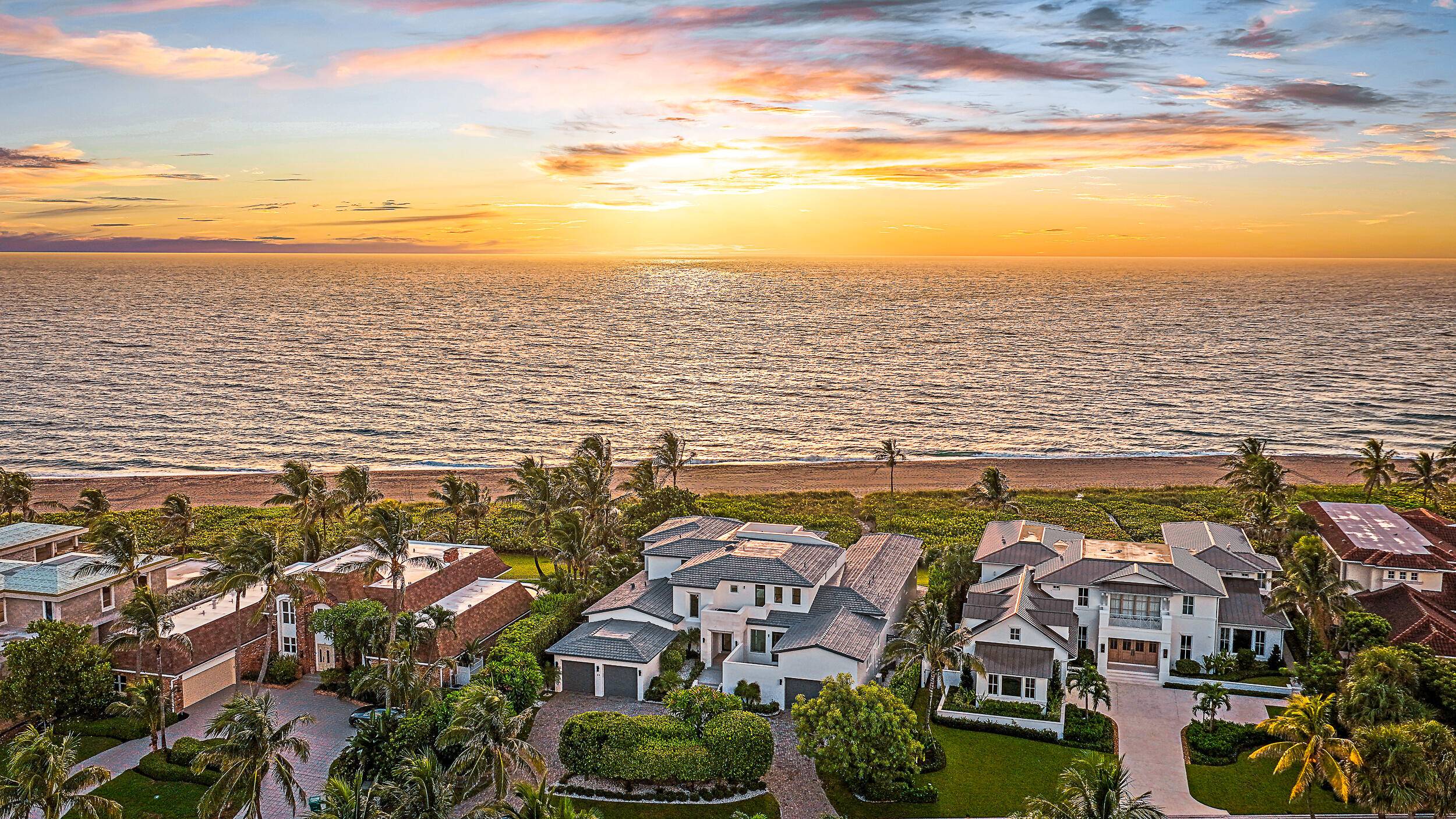 RENOVATION ADDITION COMPLETE Ocean views greet you the moment you approach the new pivot front door, drawing your eye through expansive impact rated sliders and windows that flood the interior ...