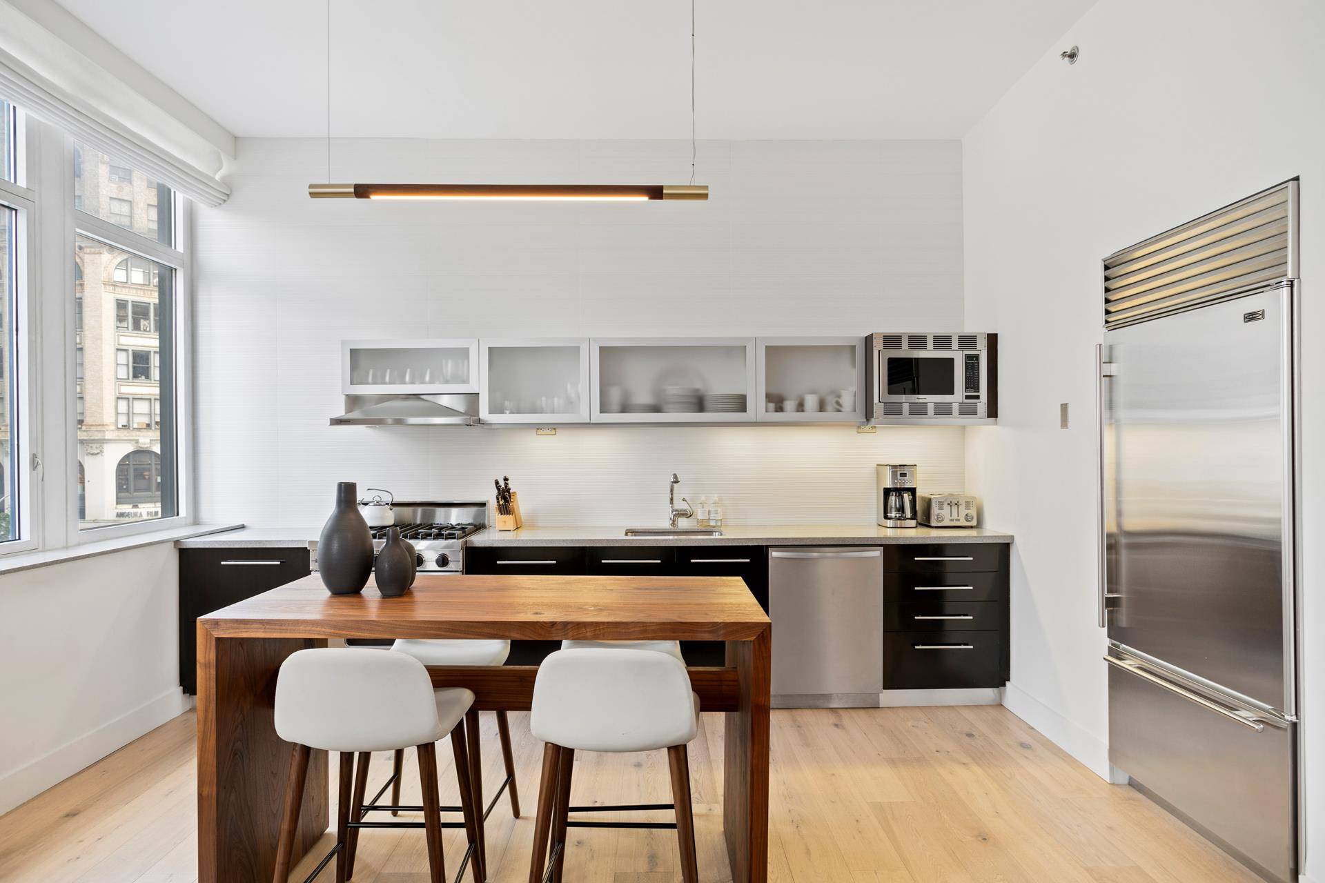 Large and bright, 1443 SF renovated corner two bedroom, two bathroom at the coveted full service doorman condo SOHO25, located between Greene and Mercer.