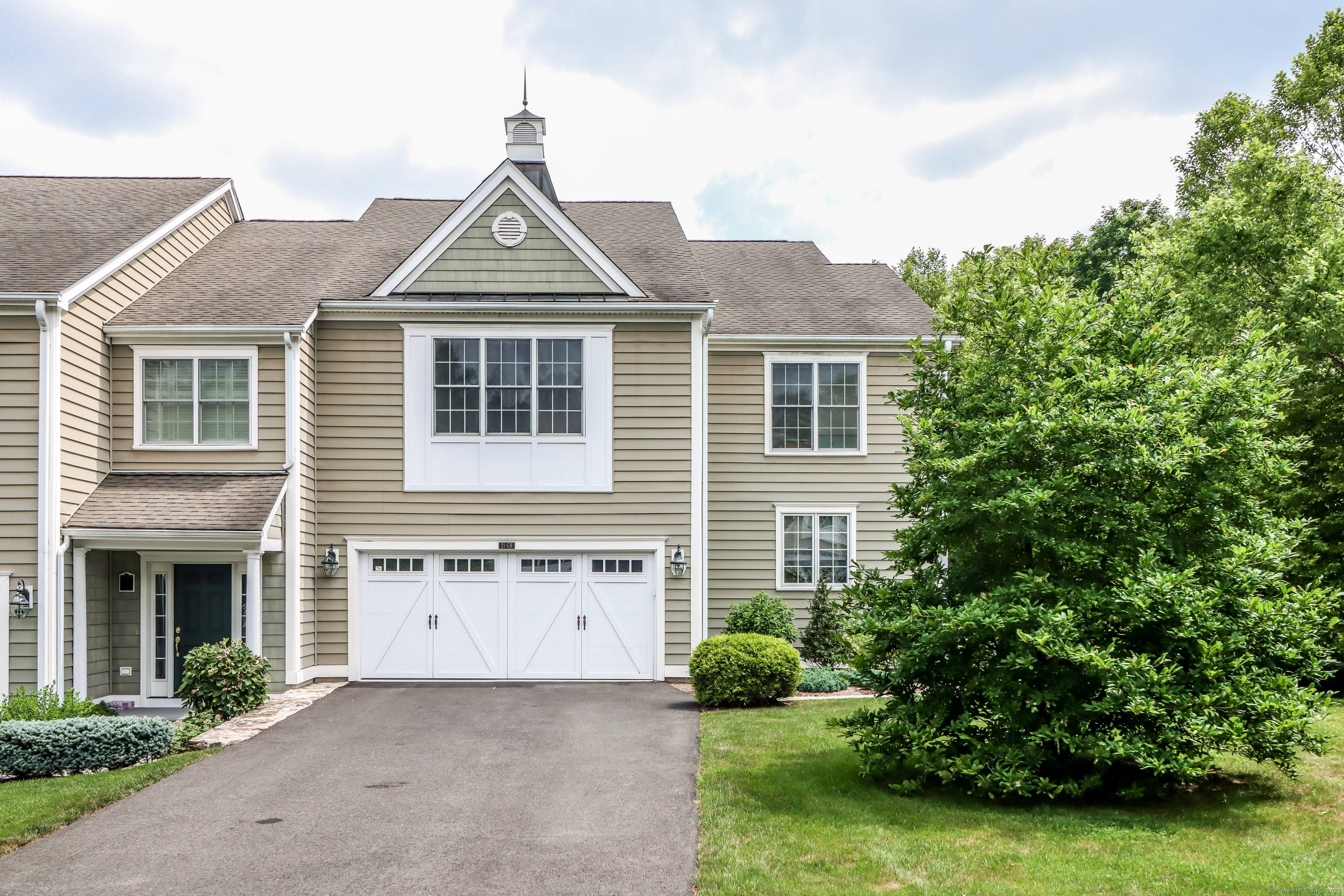Experience refined living in this stunning townhome set in desirable Newbury Village.