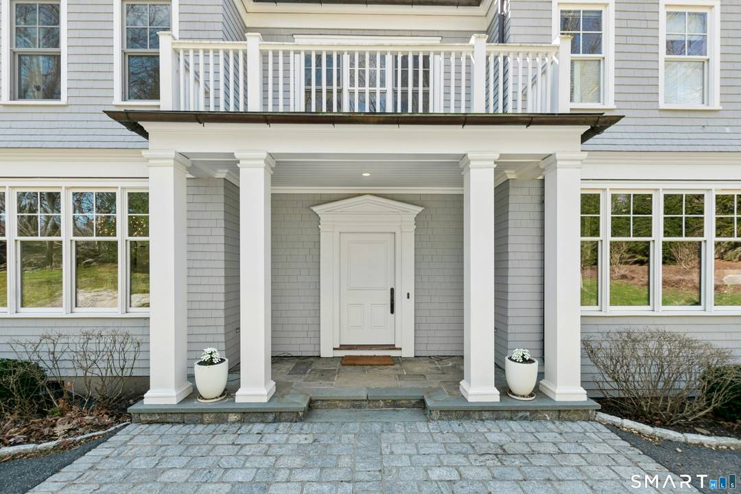 Situated proudly on a knoll near the center of town, this beautifully crafted Nantucket style Colonial blends timeless grandeur with effortless livability.