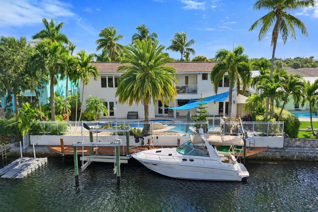 A rare opportunity and a true boater's dream with direct ocean access and no fixed bridges, this expansive two story waterfront residence offers over 4, 400 square feet of exceptional ...