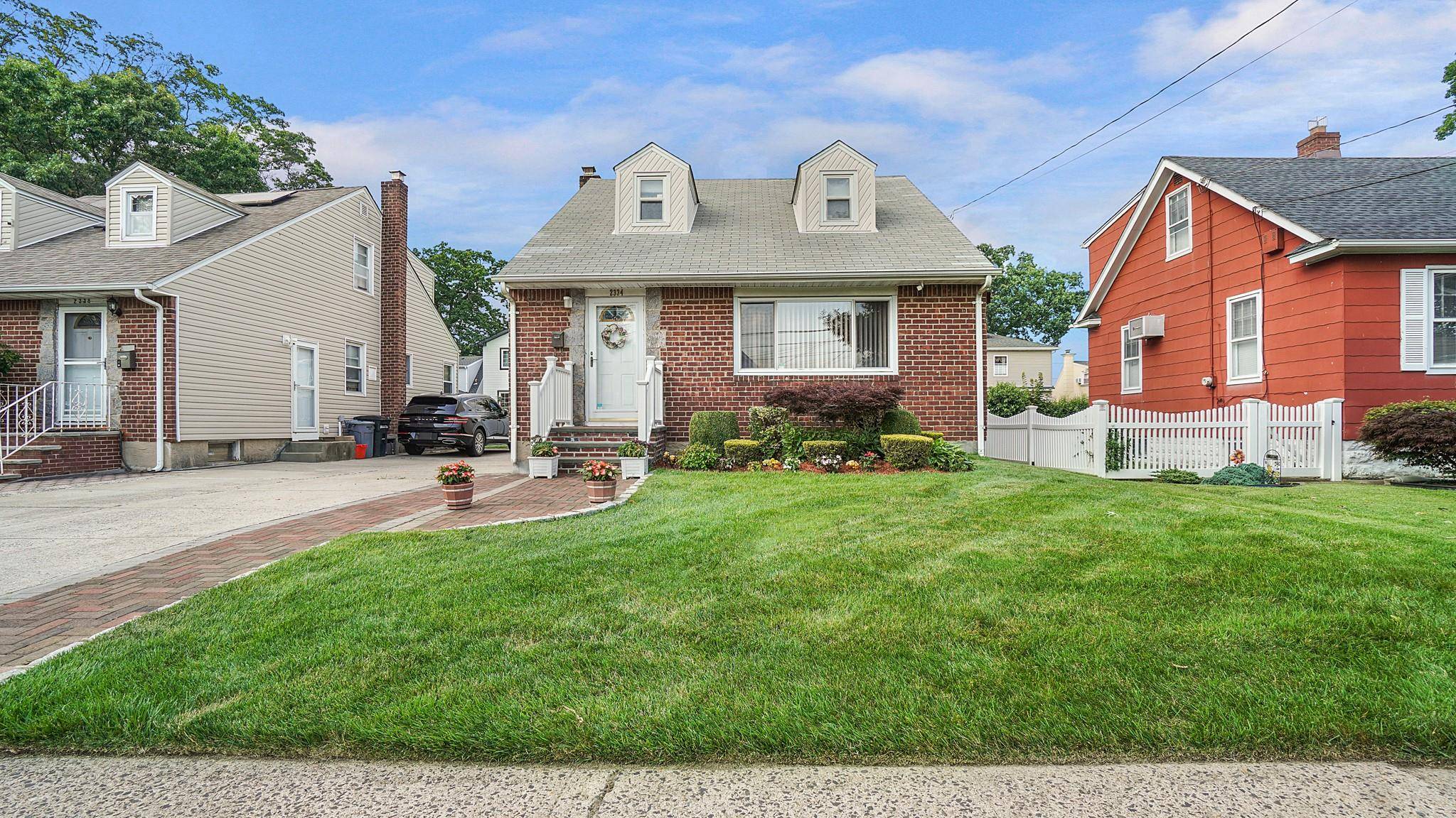 Welcome to this beautifully maintained brick cape style home nestled in the heart of Elmont.
