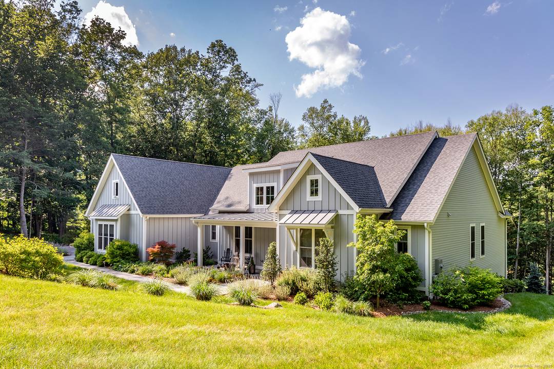 This elegant four bedroom home, built in 2021, is perfectly sited on 1.