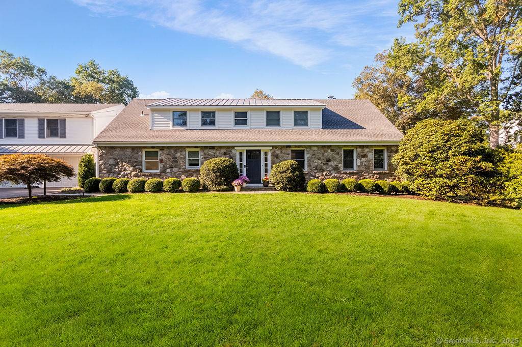 Located in the heart of one of Westports most coveted walk to town cul de sac locations on 1 ac.