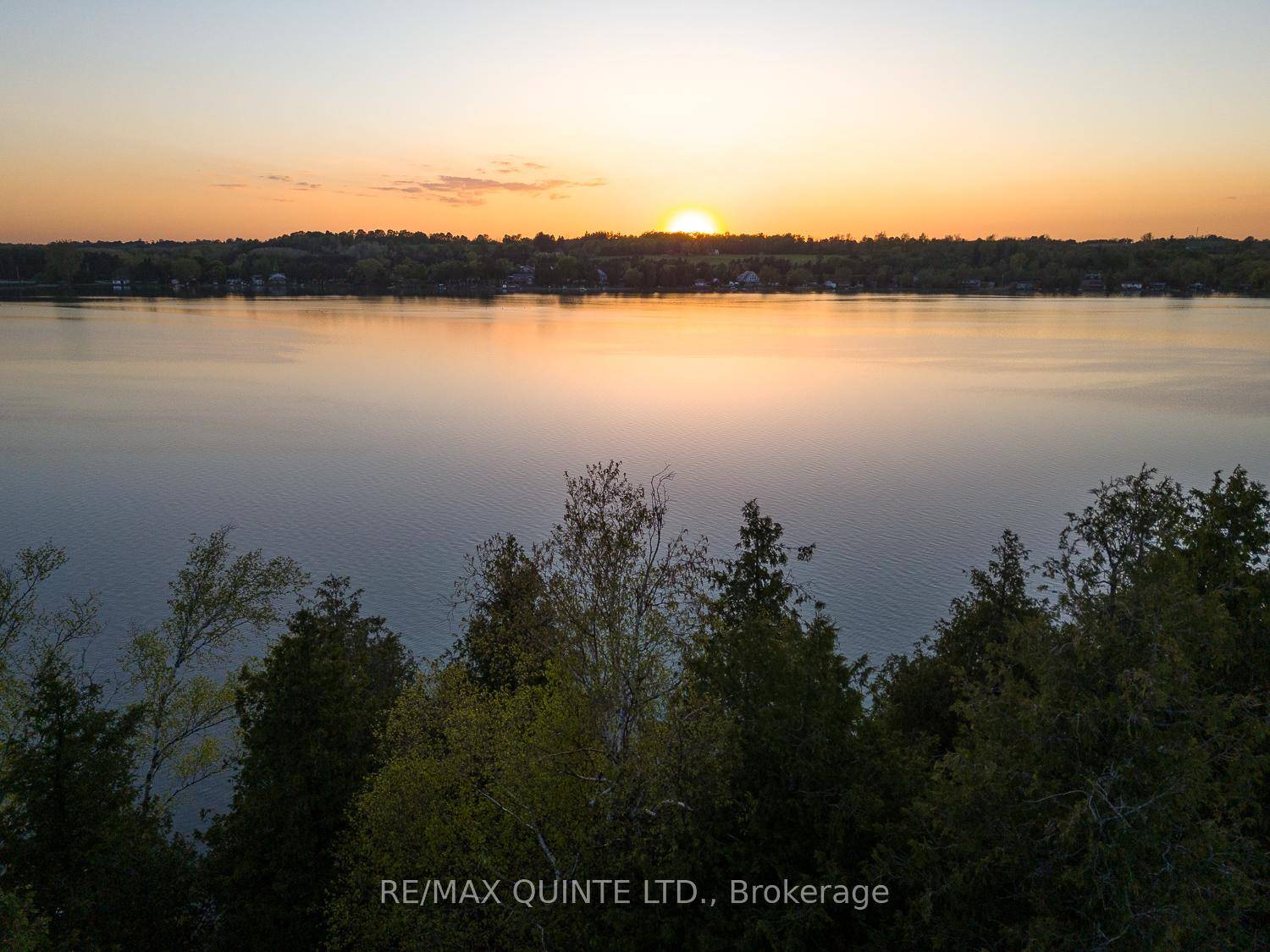 Your Own Slice of ParadiseBreathtaking sunsets await you every evening at this charming lakefront cottage that radiates ambiance and tranquility.