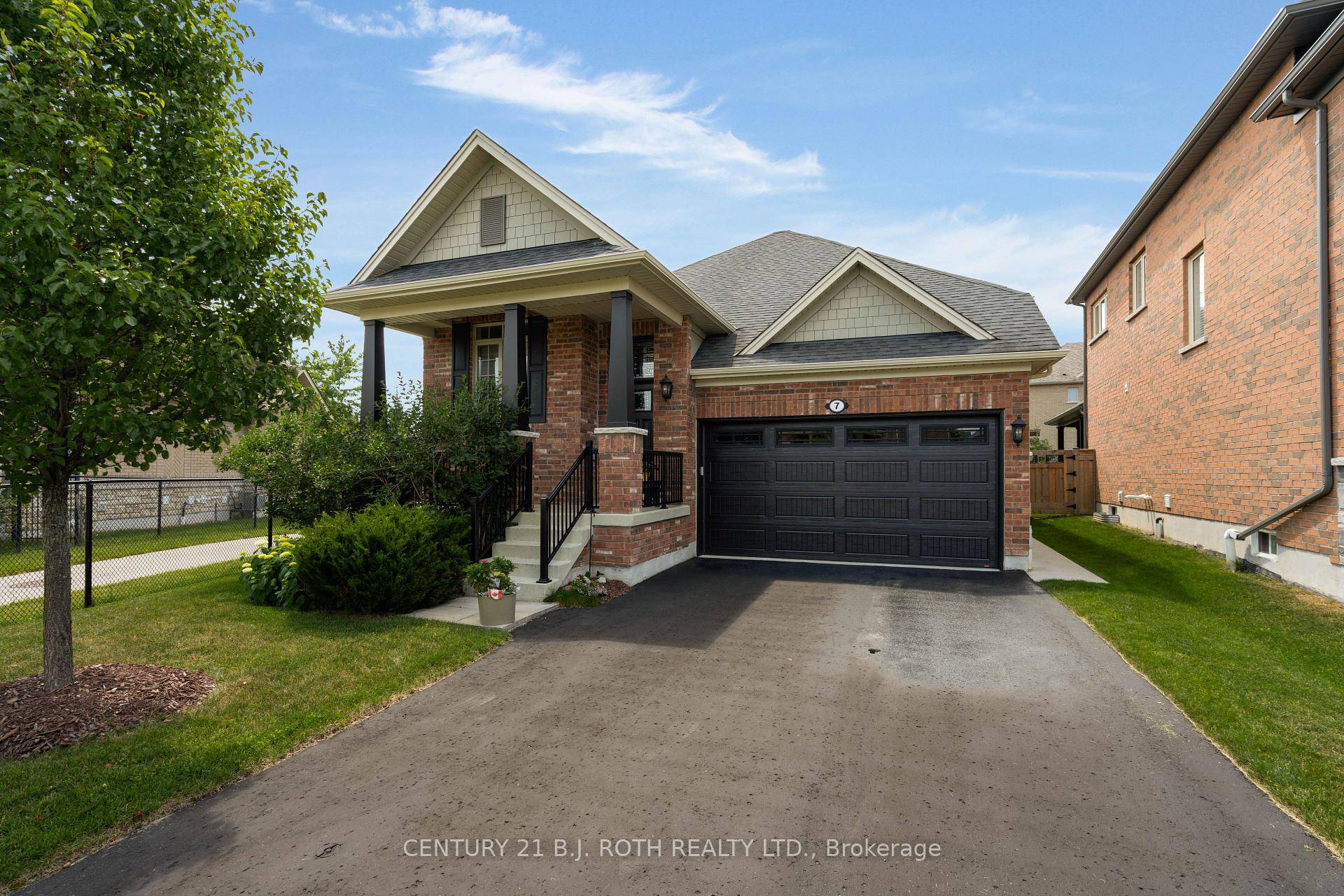 Executive Brick Bungalow Located Within Sought After Stone Manor Woods.