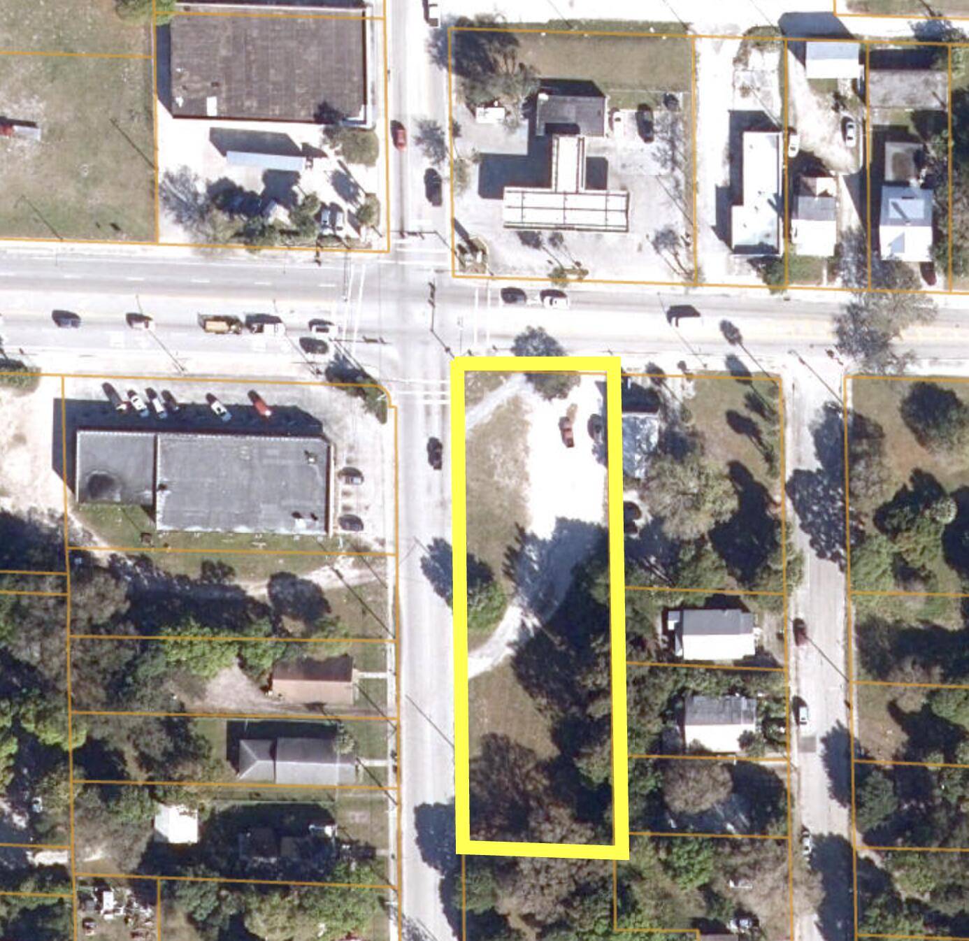 Strategically located on a signalized hard corner along the revitalizing Orange Avenue corridor, this 0.