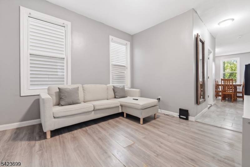 This legal two family home features 8 bedrooms and 3 full baths on a quiet Newark street.