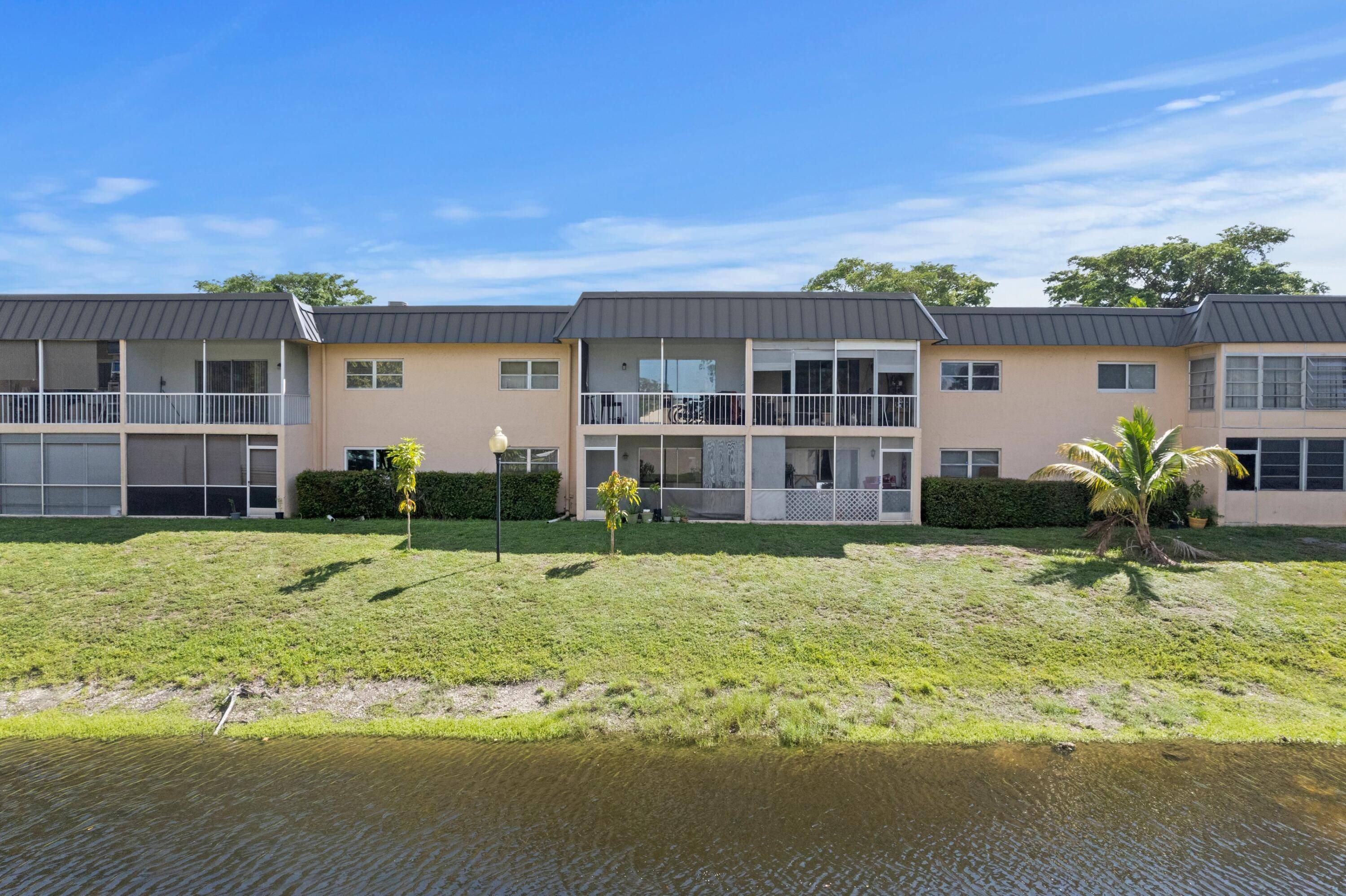 RARE INVESTOR OPPORTUNITY RENT RIGHT AWAY ABSOLUTELY GORGEOUS WATERFRONT CONDO PRESTIGIOUS SANDALFOOT SQUIRE BREATHTAKING CANAL VIEWS WALK TO POOL NEW 2025 METAL ROOF LOW HOA FEES 1st Floor Bright Open ...