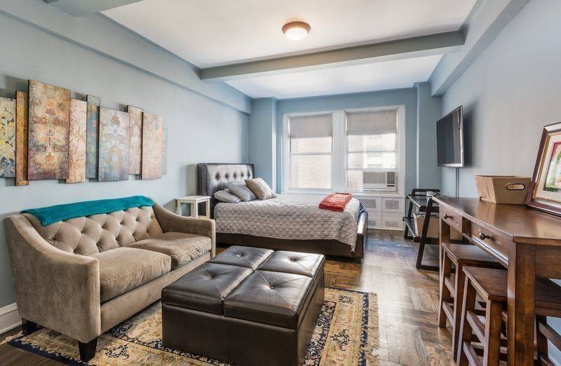 Wonderful West facing Prewar Studio with beamed high ceilings, hardwood floors, renovated Pullman kitchen, large bath and two closets.