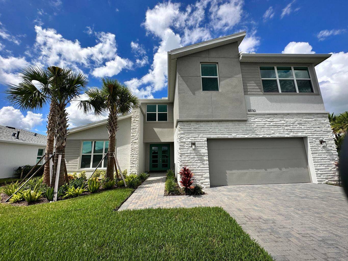 This modern Rowan built in 2022 boasts almost 3400 square feet under air, plus a den and a large loft upstairs.