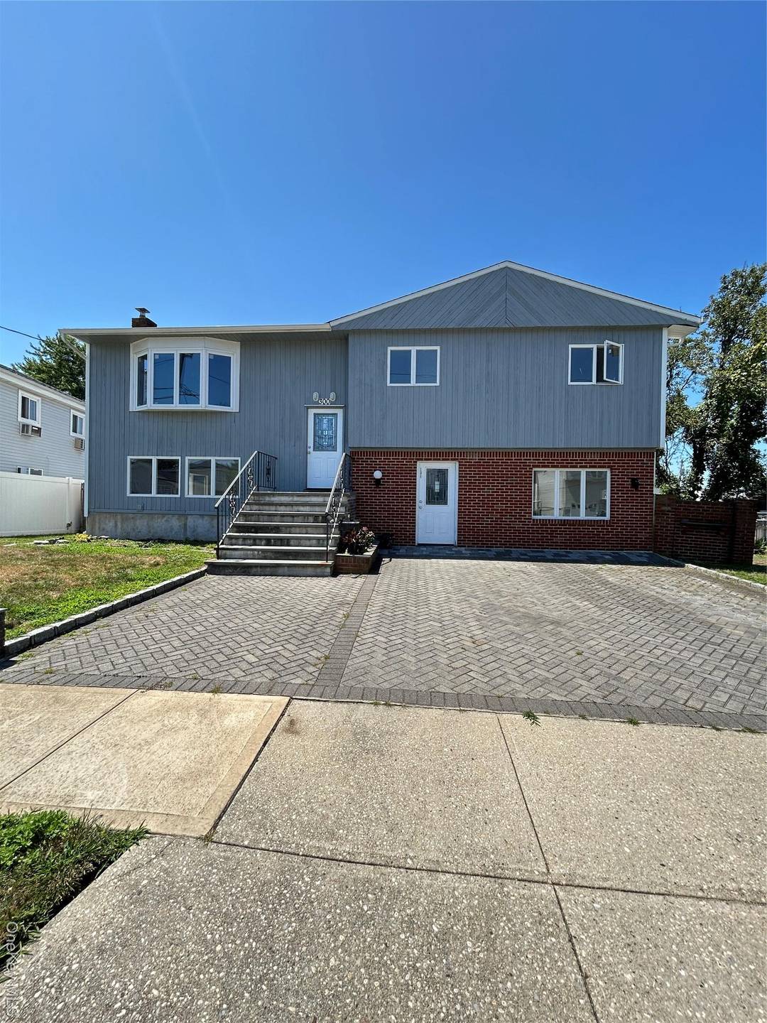 Discover this beautifully renovated Hi Ranch, just three houses from Open Bay on a serene canal.