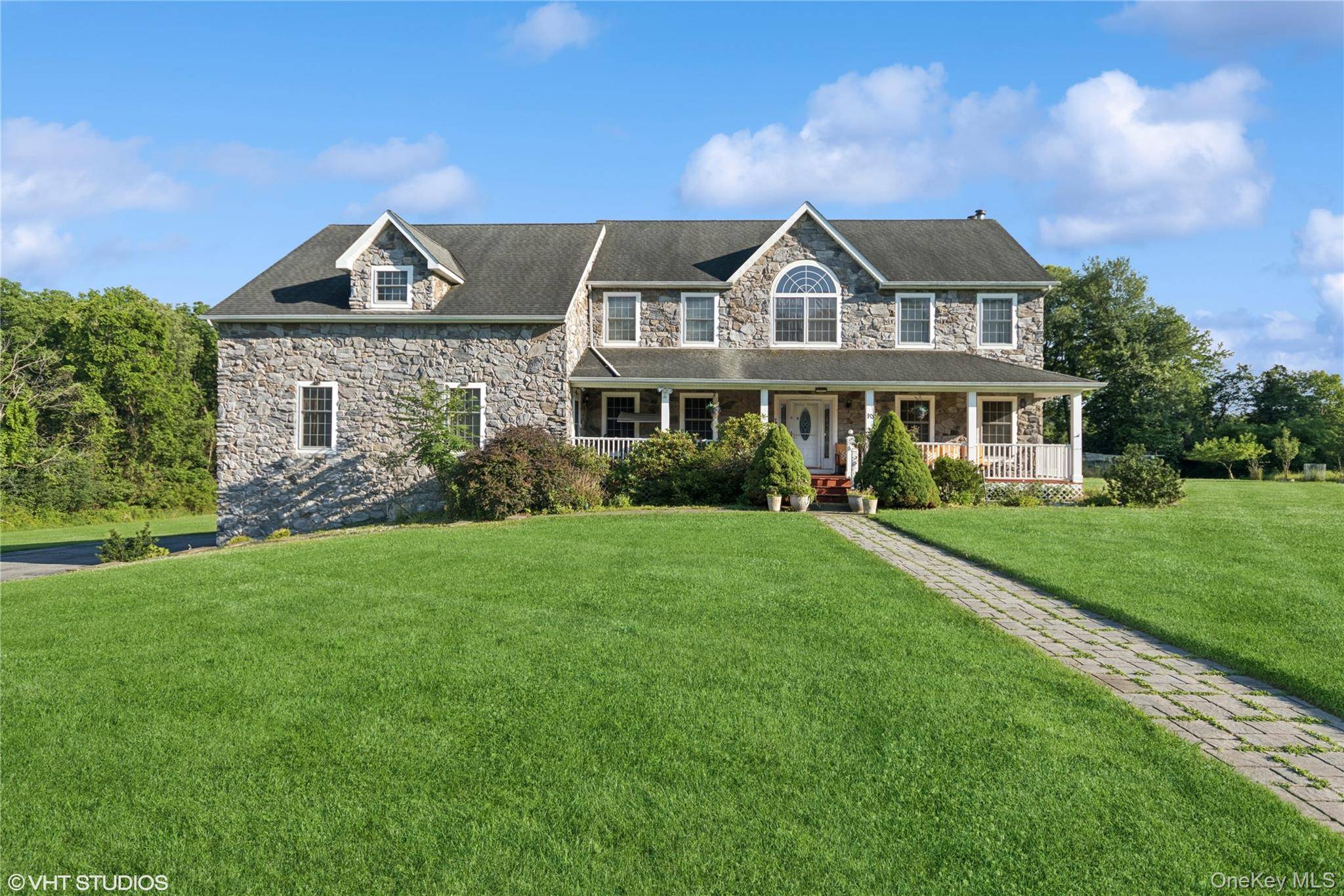 Welcome to 10 Willys Court a rare colonial mega mansion featuring a luxurious and versatile mother daughter layout, like two homes in one, perfectly situated on a picturesque 2.