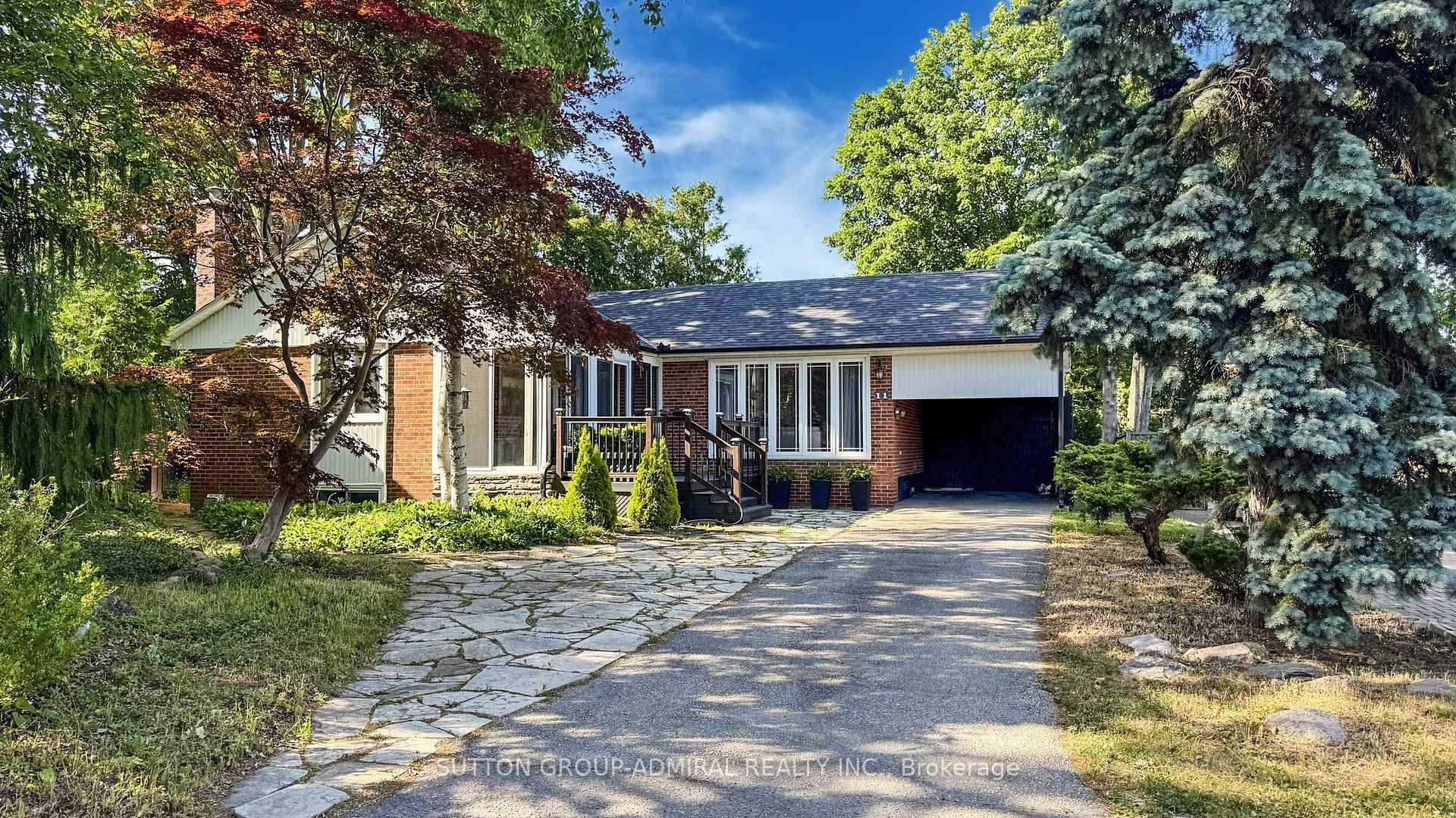 Beautiful Cottage style 3 bedroom bungalow with a large private pie shaped lot, a new fence, in a quiet neighborhood.