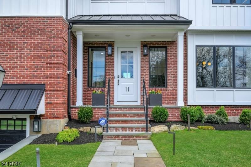 Exceptional 2020 built Northside home offering 5 bedrooms, 5 full and 1 half baths with 10 ft high ceilings.