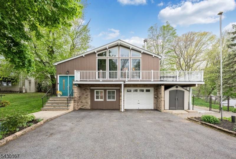 Spectacular water views and sun filled living spaces define this updated 3 Bedroom, 3 Bath contemporary home set on approximately.