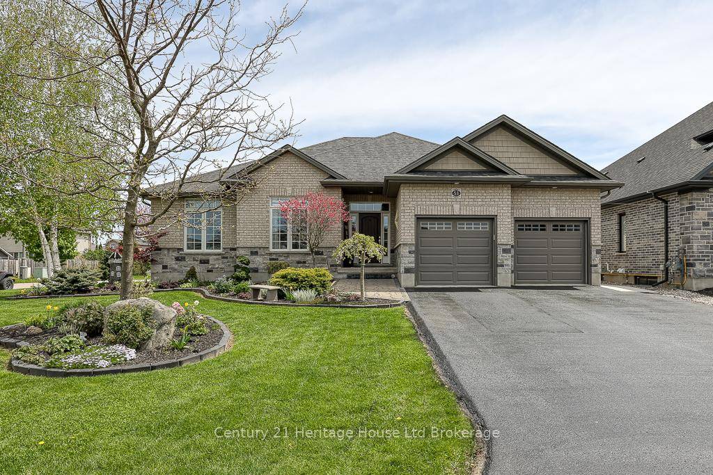 Welcome to 57 Fuller Drive, an exquisite custom built brick bungalow with nearly 4, 000 sq.