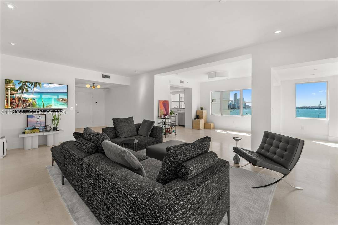 Modern 7th floor unit with 9 ft ceilings offering light, bright, and spacious living with sweeping bay views from all rooms.