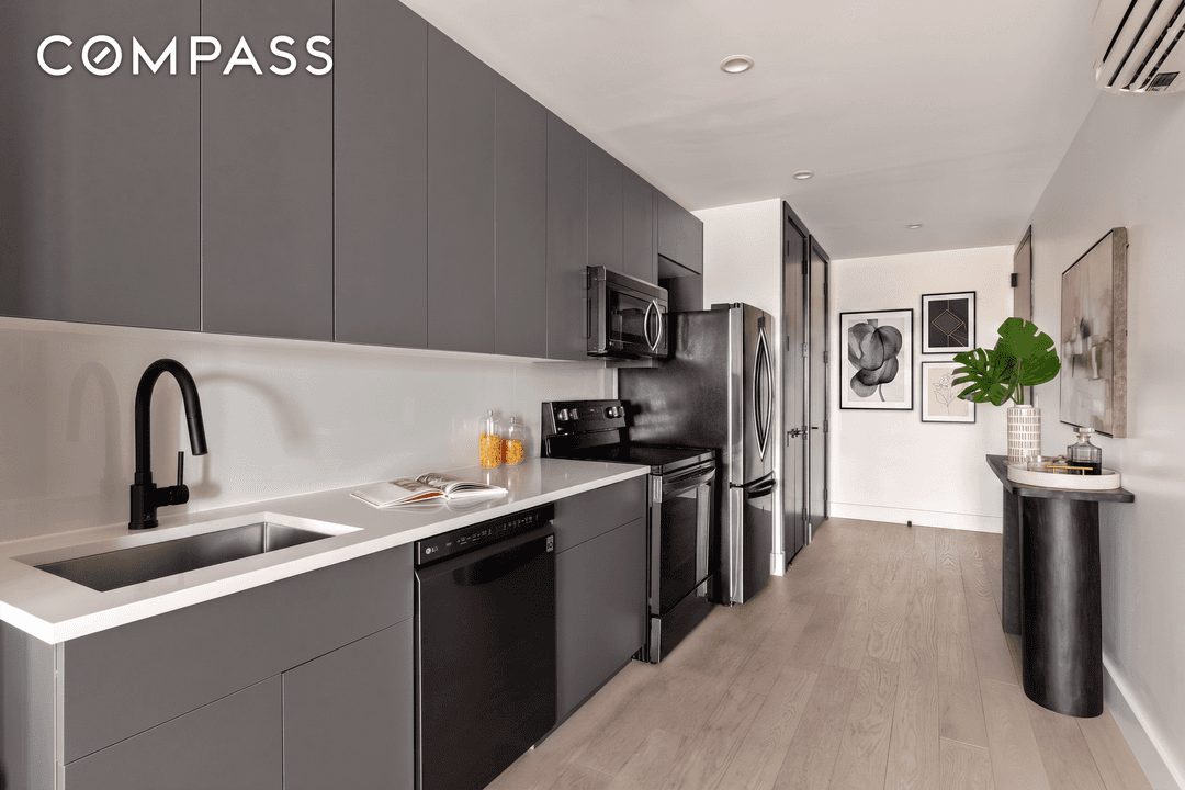 Industrial edge meets clean, modern design in this sleek, sunlit 1 bedroom home office condo at The Newkirk.