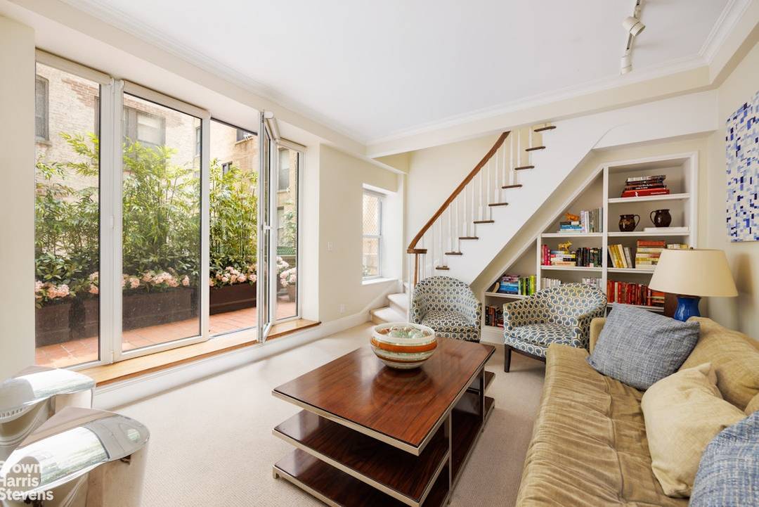 Welcome to this beautifully renovated townhouse like duplex with private outdoor space plus the full service convenience of a staffed, elegant boutique prewar cooperative !