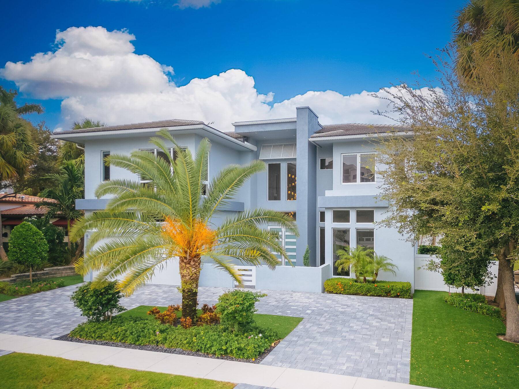 Welcome to this beautiful, light filled 5 bedroom, 5 bathroom residence, nestled in the highly sought after Golden Triangle of Boca Raton.