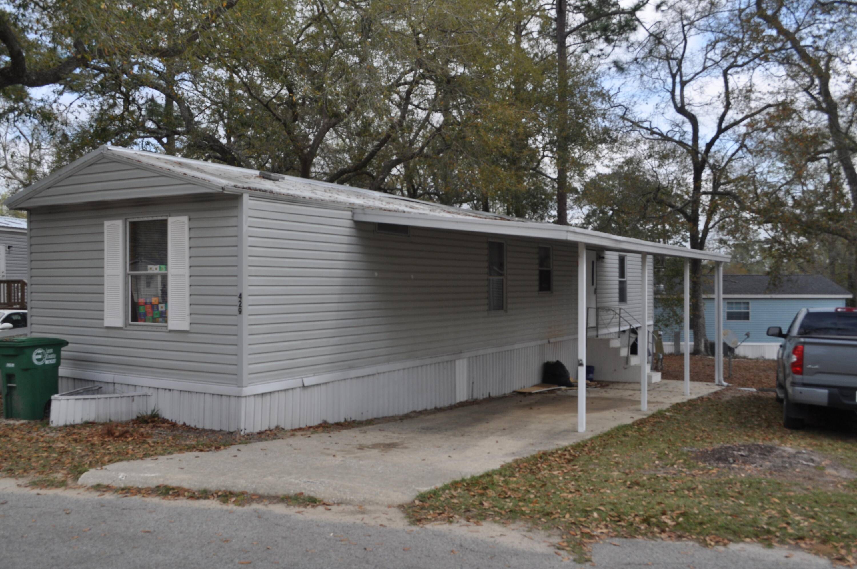 Remodeled 2 2 mobile home centrally located close to major roads, supermarket, 2 carports.