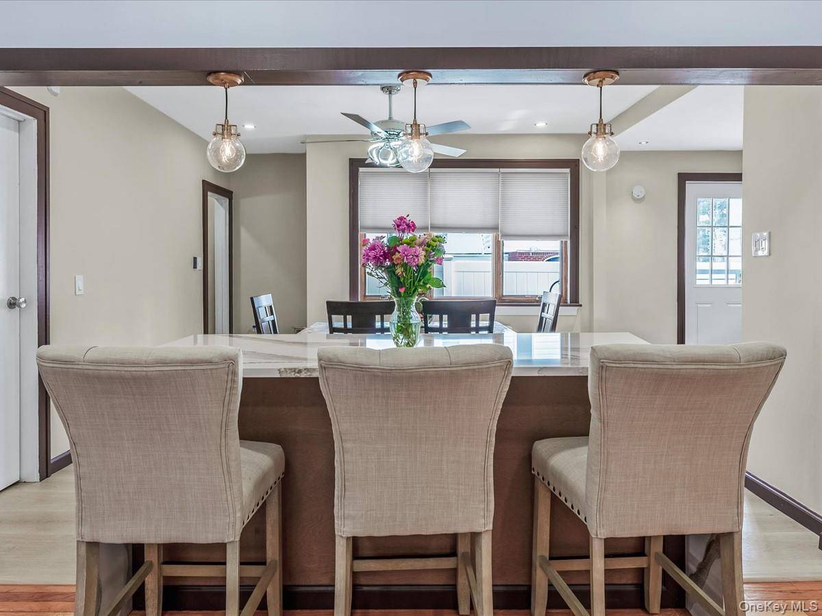 Welcome to 219 08 38th Avenue, a beautifully updated 4 bedroom, 2.