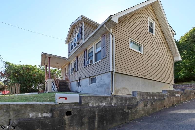 Beautiful Two Family Home on an Oversized Lot in a Prime Location !