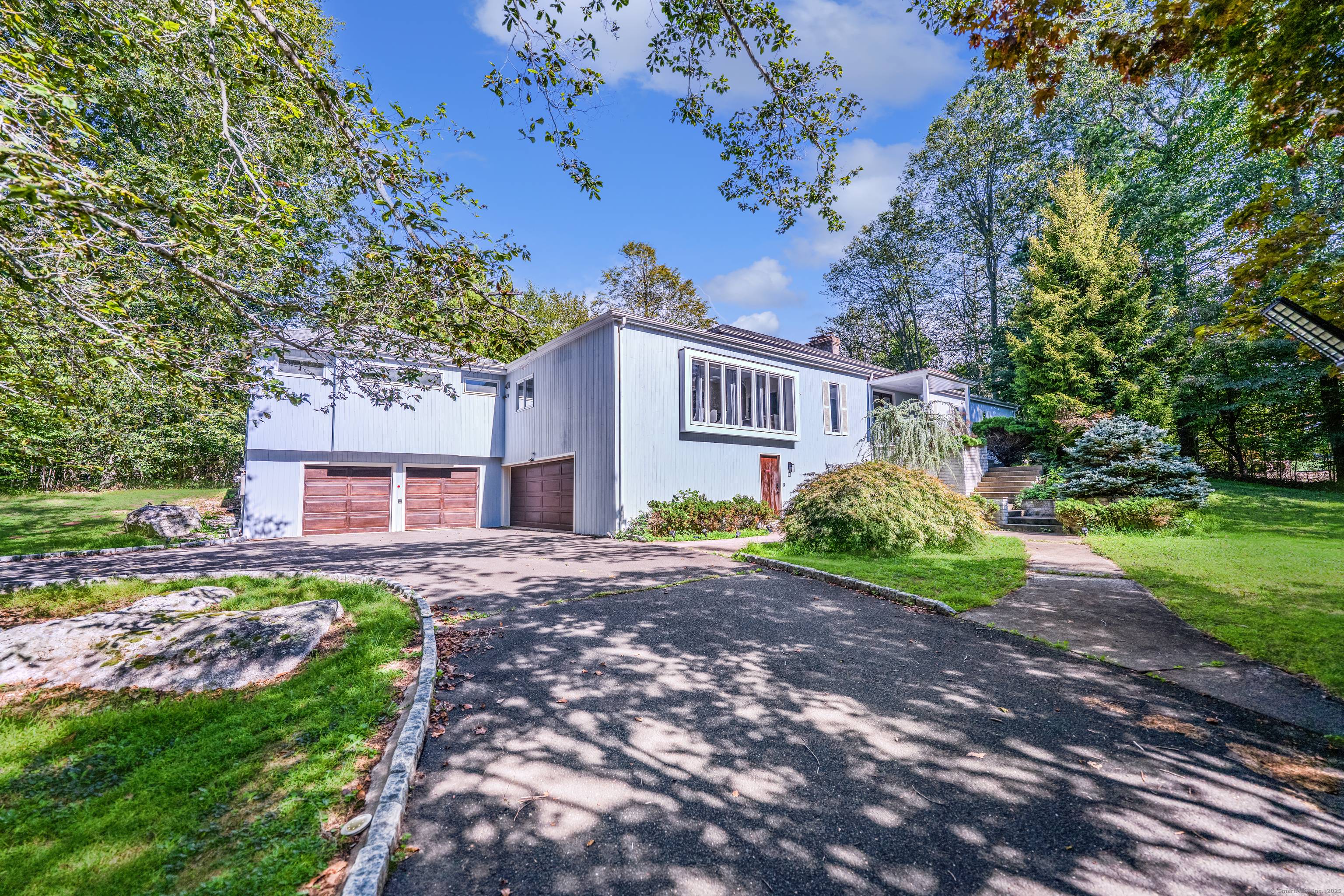 Welcome to 480 Riders Lane, a timeless mid century contemporary residence situated at the end of a charming cul de sac in the desirable Greenfield Hill neighborhood.
