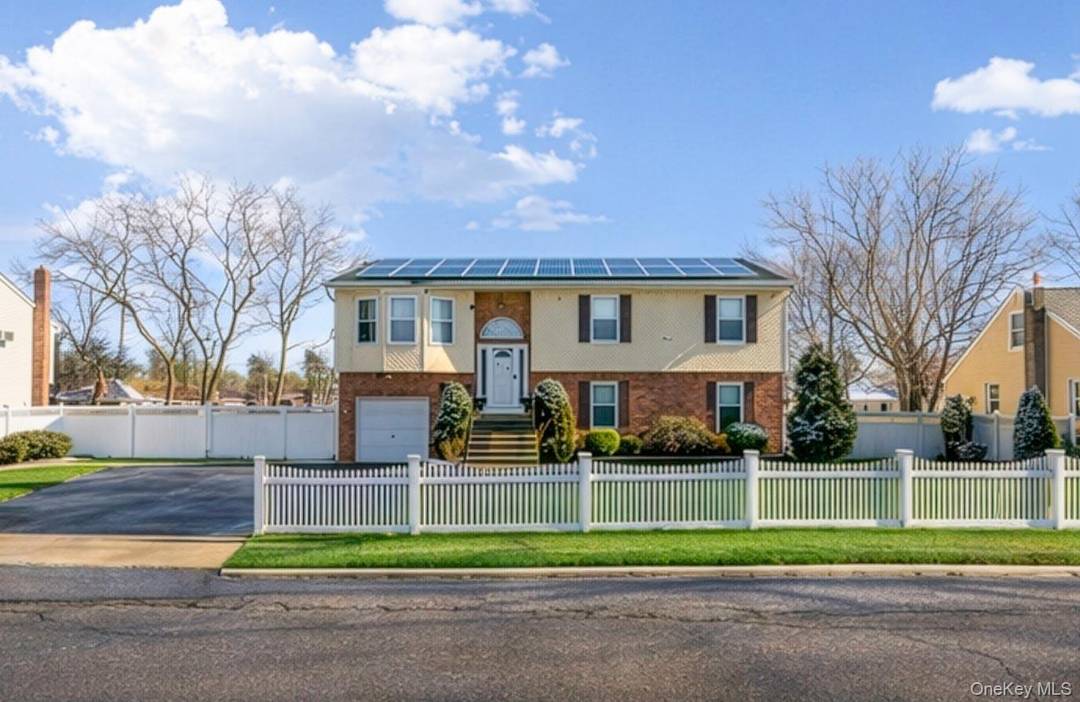 This beautifully maintained Hi Ranch split level home offers a spacious, open, and airy layout filled with natural light.