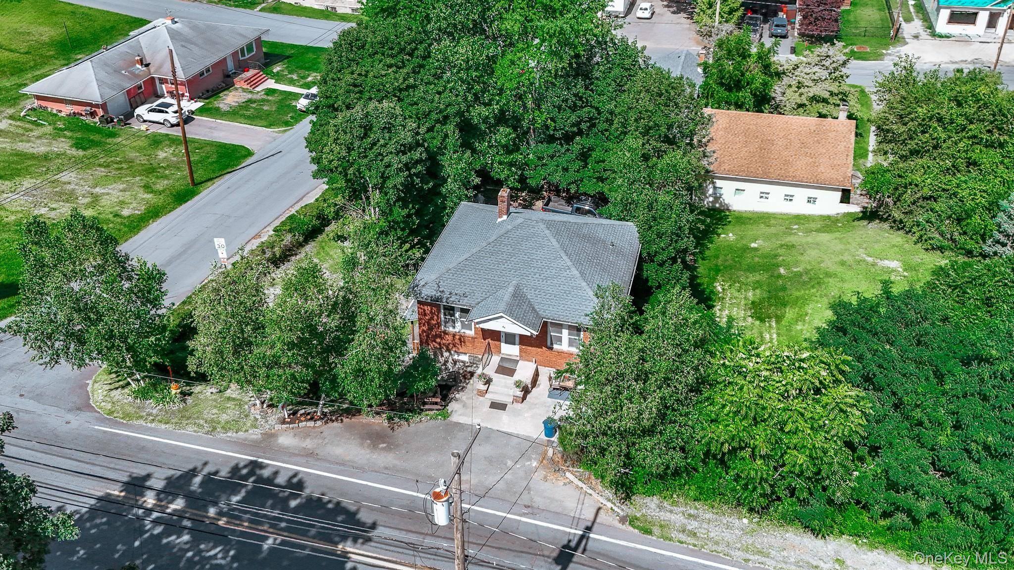 An outstanding opportunity awaits with this legal two family on a prime corner lot !