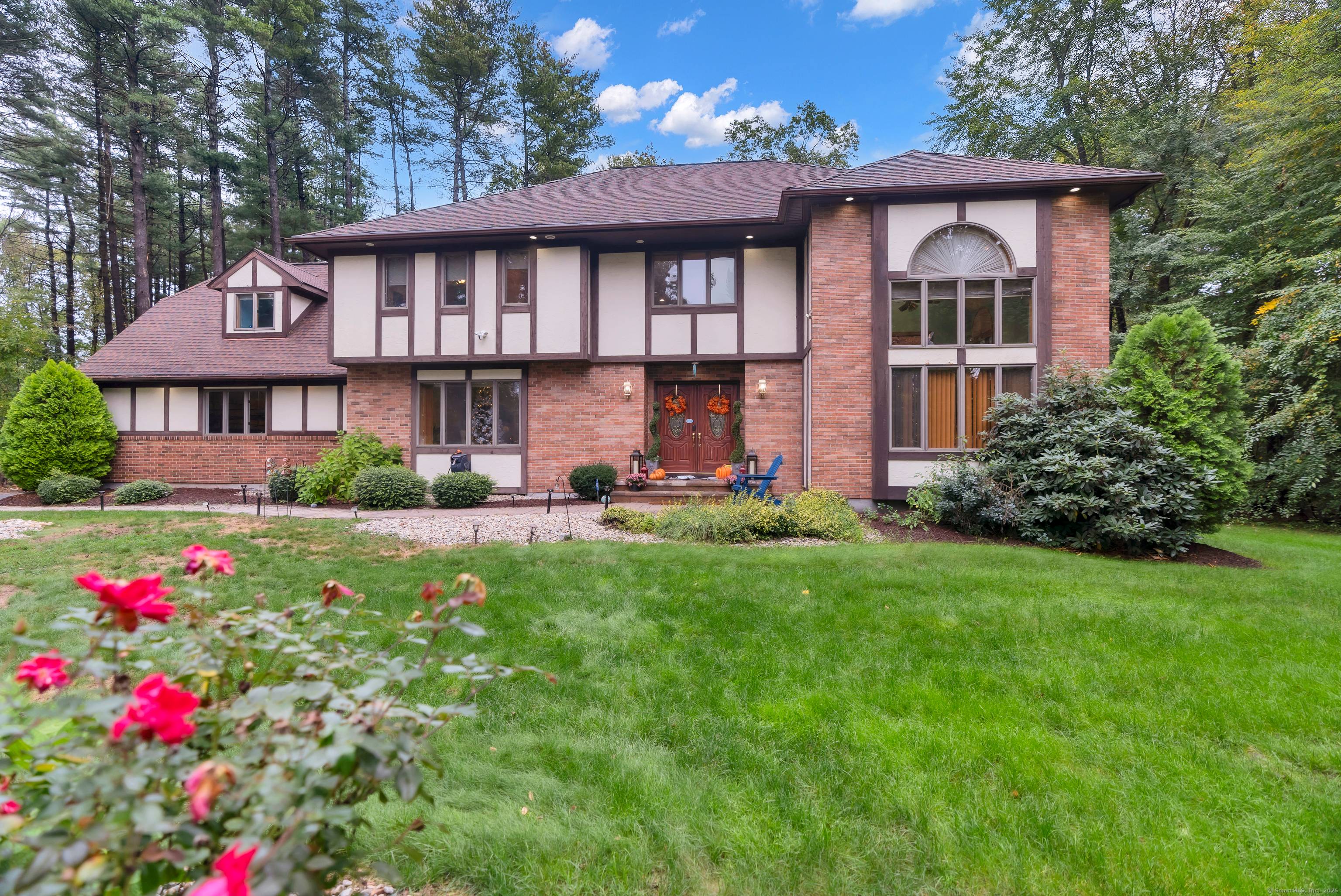 Step inside to experience an elegant blend of classic Tudor charm and modern luxury in South Windsor !