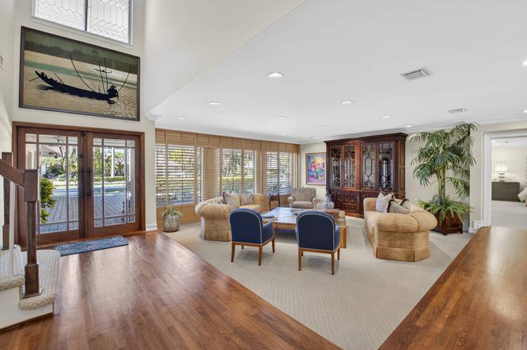 Rarely available 5 bedroom pool home on 1 2 acre in gated enclave of Oakbrook.